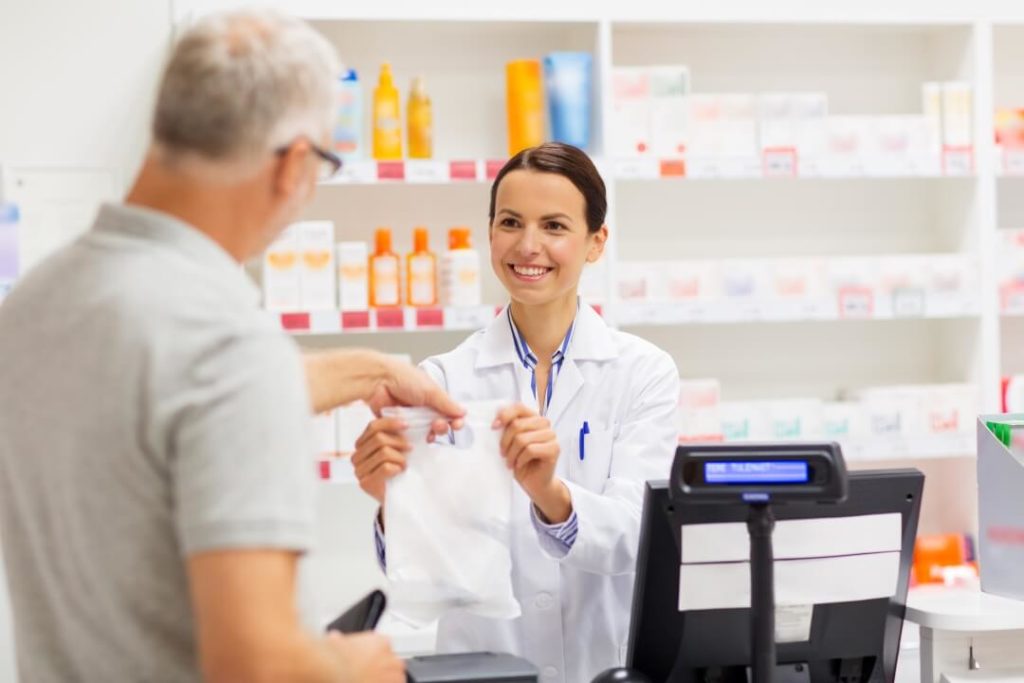 How does the pharmacy management software process the payment?